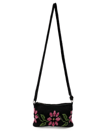Front view of a black tapestry crochet crossbody bag with a large pink and green floral design.