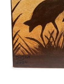 Detail shot of the artist's signature "DuJArt 2024" burned into the wood.