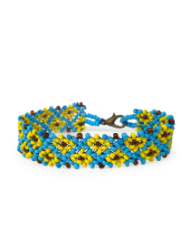 Handcrafted blue and yellow beaded bracelet fastened in a circle showing the continuous pattern.
