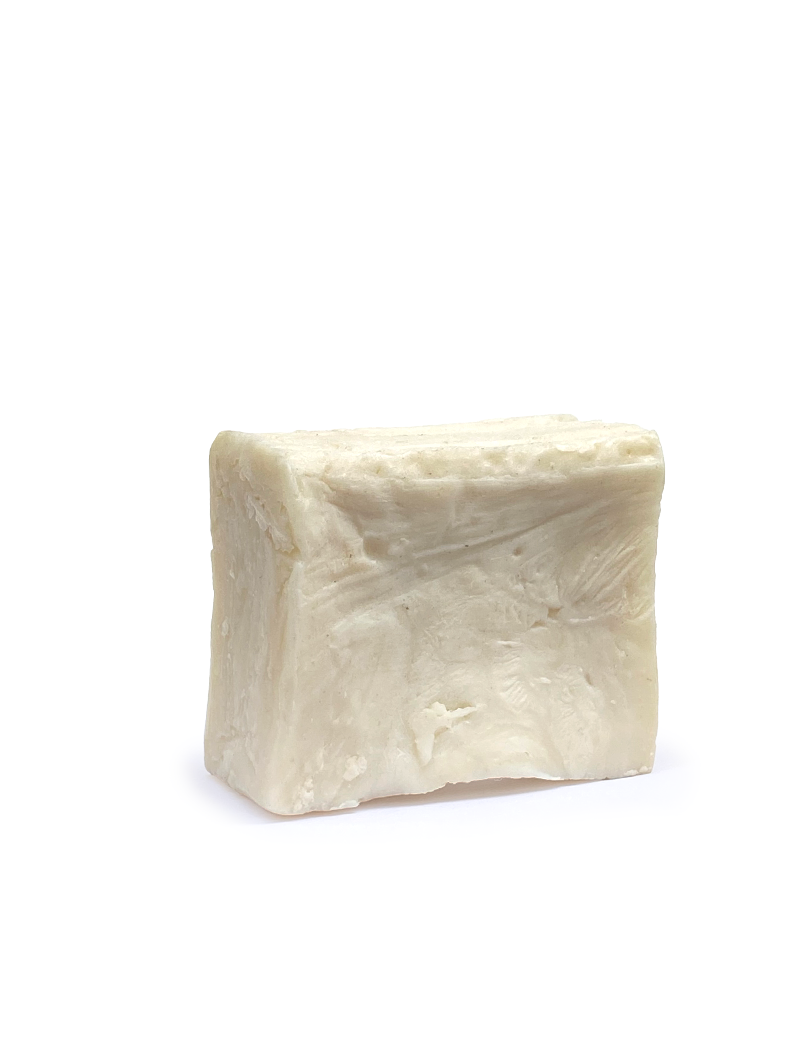Close-up of artisan laurel soap showing natural texture and cream-colored hue.