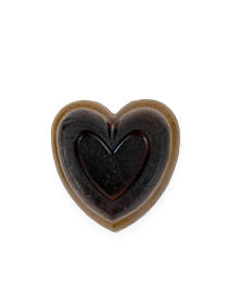 Top-down view of a decorative lavender heart soap bar on a white background.