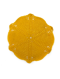 Golden yellow intricate crochet coaster for kitchen use.