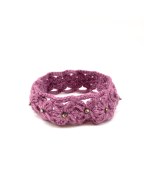 Purple crochet headband with iridescent bead embellishments.