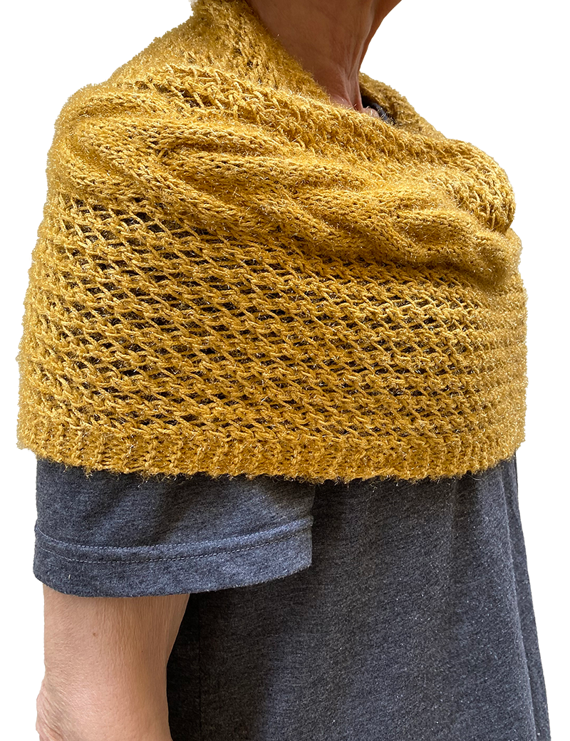 Golden pashmina wrap styled as a shoulder warmer.