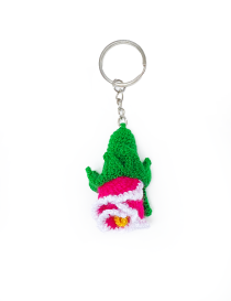 Vertical view of a handmade crochet fuchsia flower keychain with green leaves.
