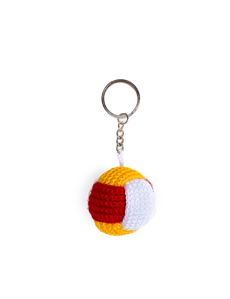 Vibrant red, yellow, and white crochet puzzle ball charm for keys.