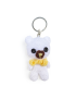 Handmade white crochet teddy bear keychain wearing a yellow scarf.