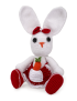 Front view of handmade white crochet rabbit in red apron holding a carrot.