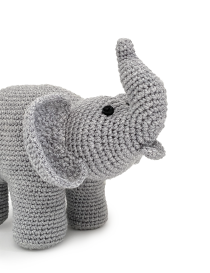 Close-up of the elephant's face showing secure black eyes and a striped bowtie.