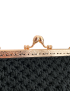 Golden kiss-lock clasp detail on a handmade black clutch.
