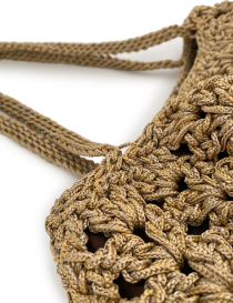Detail of the reinforced crochet shoulder straps on a beige tote.