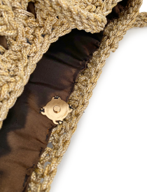 Interior view showing brown fabric lining and gold magnetic clasp.