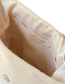 Detailed view of the internal satin storage pocket.