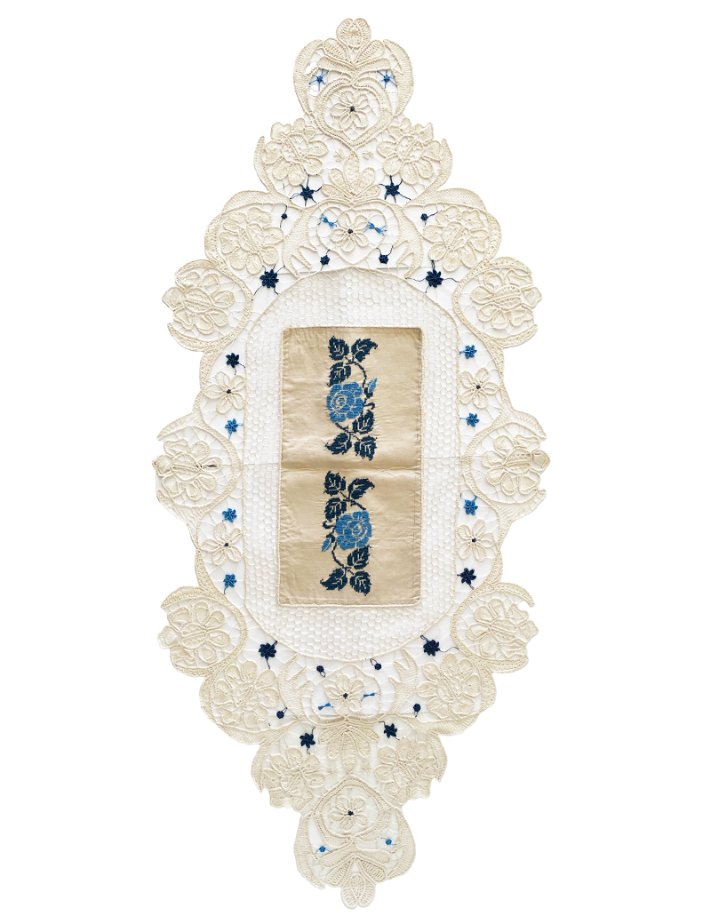 Full view of the oval Roman lace tablecloth with central blue rose embroidery.