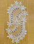 Full view of the 100x48cm lace runner displayed on a wooden surface.