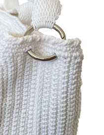 Macro shot of the high-quality crochet craftsmanship and Klim yarn texture.