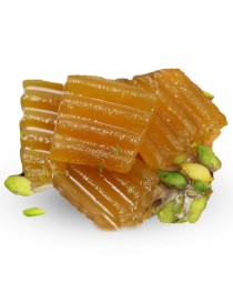Crunchy golden pumpkin jam slices with green pistachios.