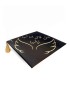 Graduation cap topper with gold Arabic calligraphy and colorful floral embroidery.