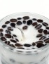 Handmade white soy candle in a glass jar decorated with whole roasted coffee beans.