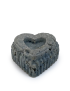 Heart-shaped natural charcoal soap with ribbed edges.