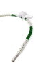 Close-up of green faceted crystals and faux pearls on a headband.