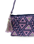 Close-up of the purple handmade bag featuring the decorative yarn tassel.