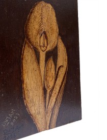 Side view showing the texture and depth of the burned wood grain on the Calla Lily art.