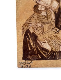 Artist signature DujArt 2023 on woodburned religious tableau.