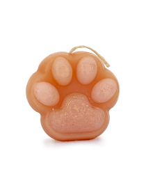 Peach-colored scented cat paw candle with pink toe beans and wick.