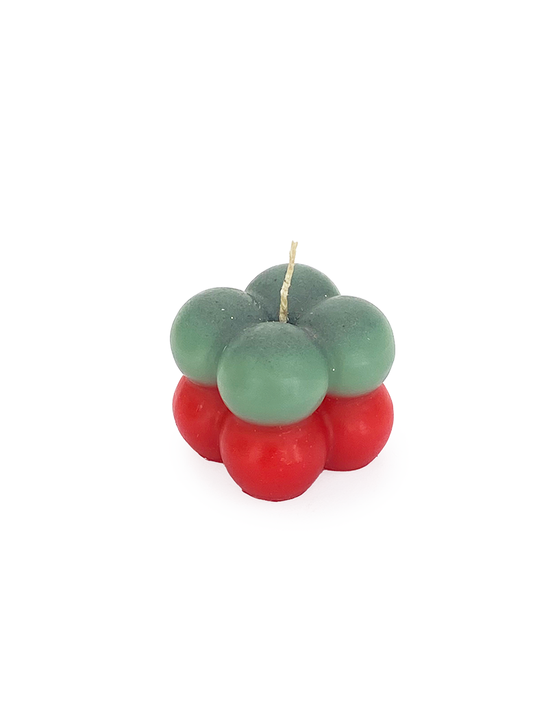 Top perspective view of red and green bubble candle with wick