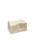 Rustic block of handmade olive oil and laurel soap on a white background.