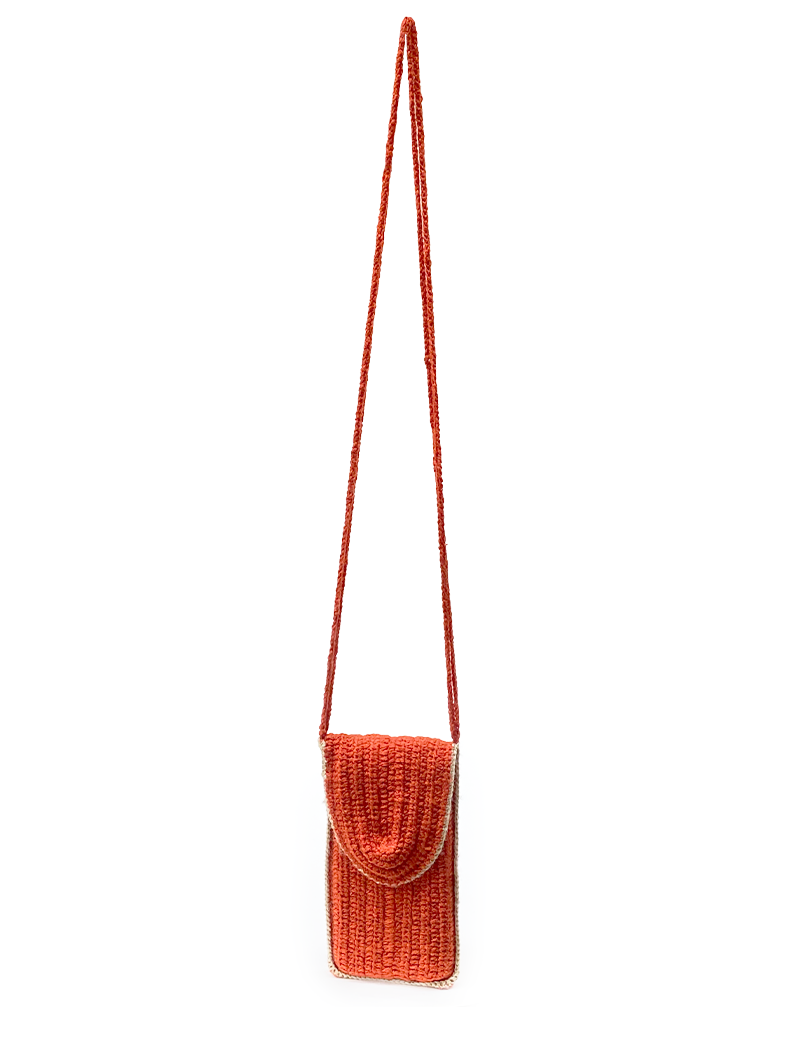 Full view of orange crochet mobile pouch with long crossbody strap.