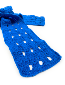 Close-up of the textured wool stitching and eyelet details of the royal blue handmade scarf.