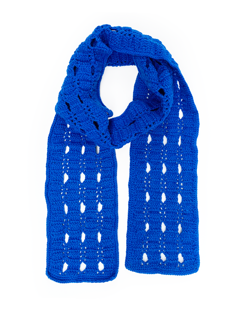 Full view of a bright royal blue crochet scarf with geometric open-stitch patterns on a white background.