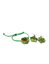 Complete handmade crochet jewelry set featuring floral bracelet and matching earrings.