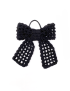 Top-down view of a black crochet ribbon bow hair tie with mesh pattern.