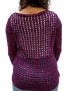 Side profile of woman in purple crochet top highlighting the sleeve fit and lace texture.