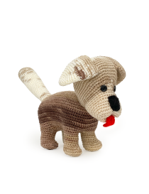 Full side view of a brown variegated crochet dog with an upright cream tail.