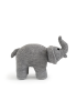 Profile view of the crochet elephant showcasing its trunk and sturdy sitting posture.