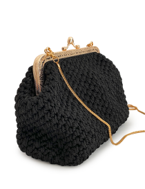 Side profile of the structured black macramé evening bag.
