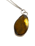 Translucent Tiger’s Eye stone showing golden internal glow.