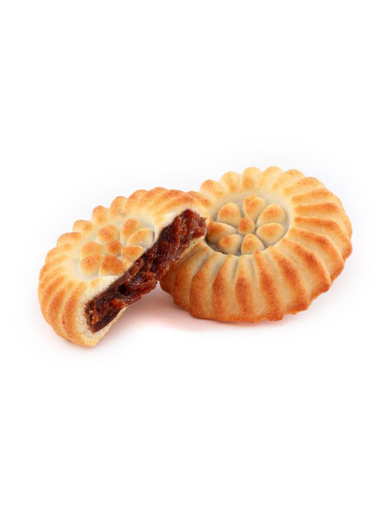 Hand-pressed date ma’amoul cookies showing decorative semolina crust and rich date filling.