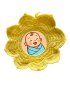 Yellow crochet flower photo frame with baby illustration