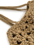 Detail of the reinforced crochet shoulder straps on a beige tote.