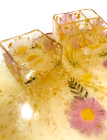 High-angle shot of a 9-slot resin stationery holder with golden flakes.