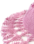 Detailed shot of intricate crochet stitching on a pink cotton hat.