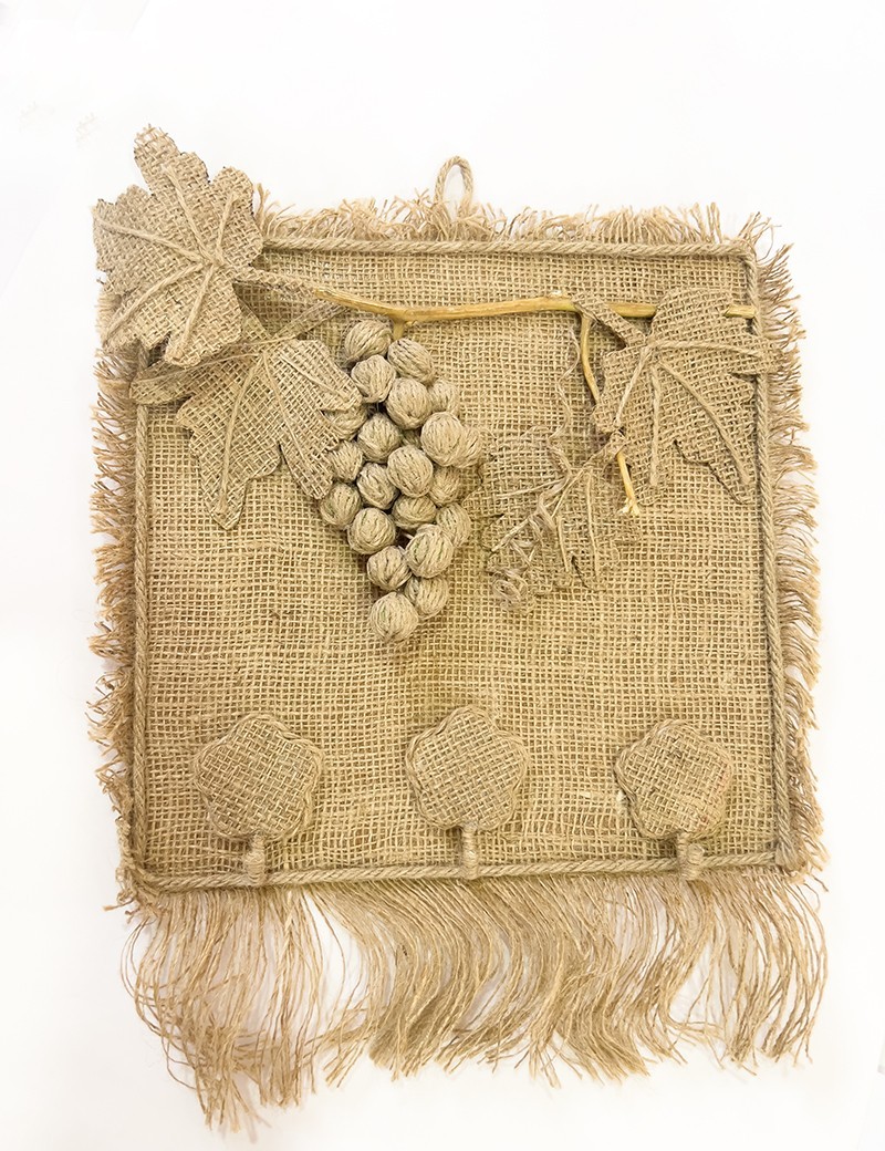 Handmade burlap wall hanger with 3D twine grape cluster and three hooks.