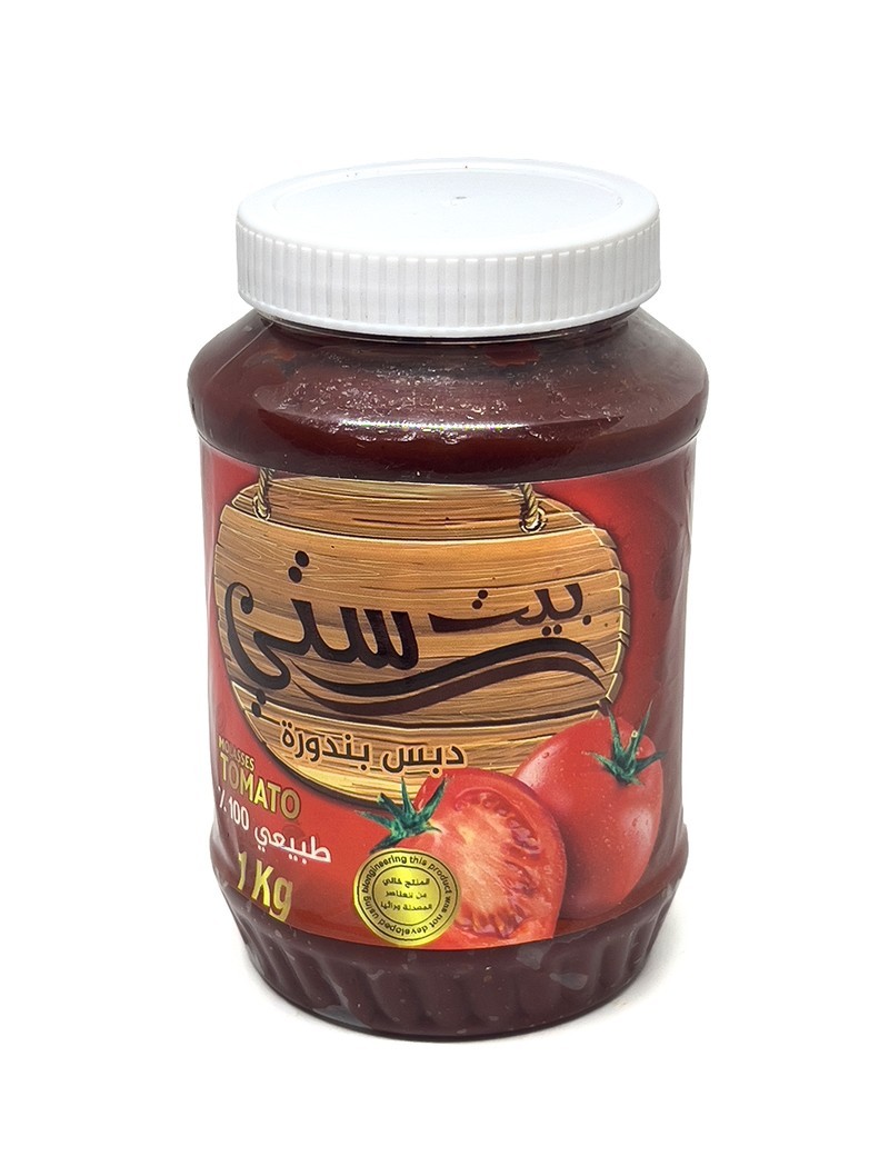 1kg jar of Beit Sitti Tomato Molasses with fresh tomato graphics.