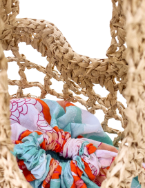 Light beige raffia mesh crochet tote bag with colorful floral inner pouch.