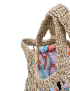 Light beige raffia mesh crochet tote bag with colorful floral inner pouch.